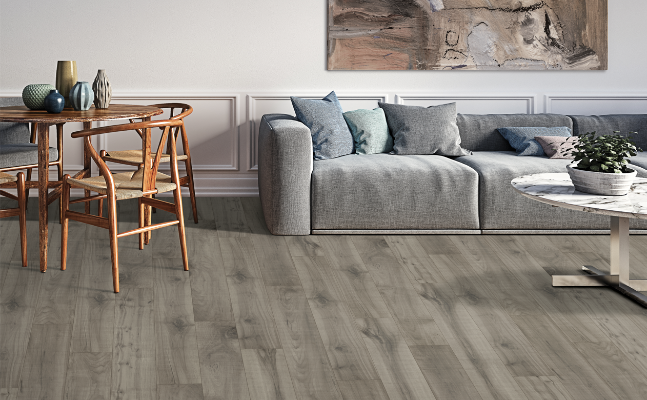 Greyish laminate wood look planks with bistro set and modern couch 