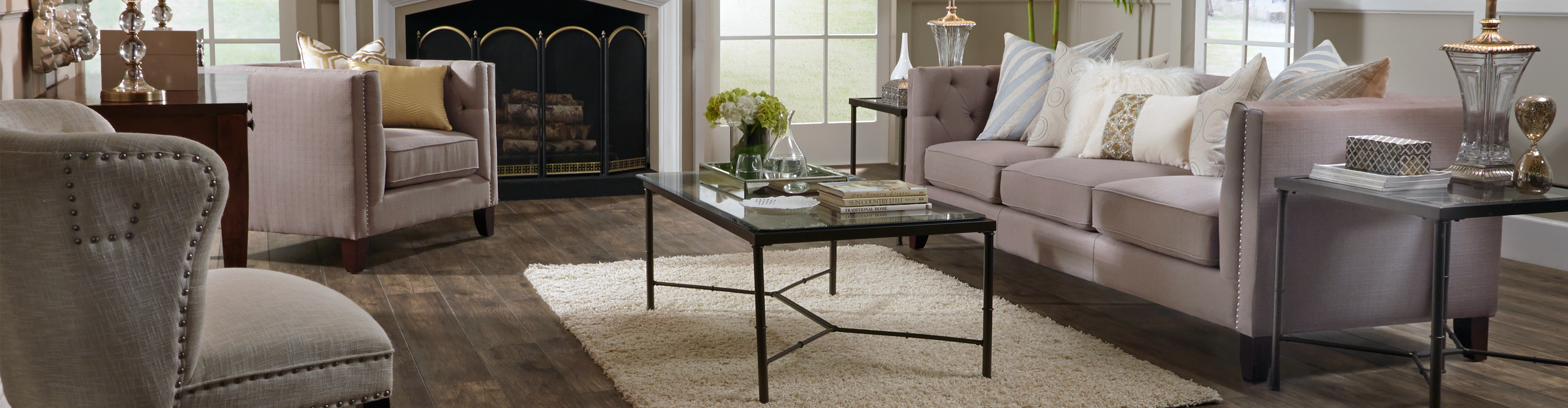 Formal living room with darker wood laminate, corner palm 